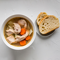 Dipping Challah in Soup
