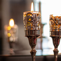 Lighting Shabbos Candles in Front of a Mirror
